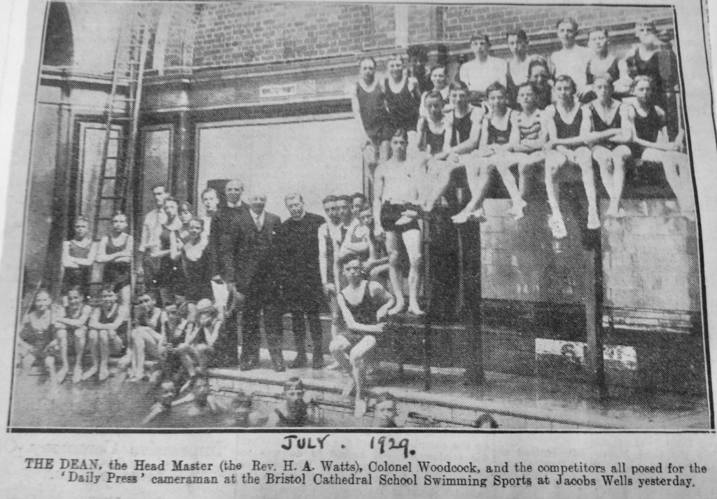 Children in bathing costumes posing poolside