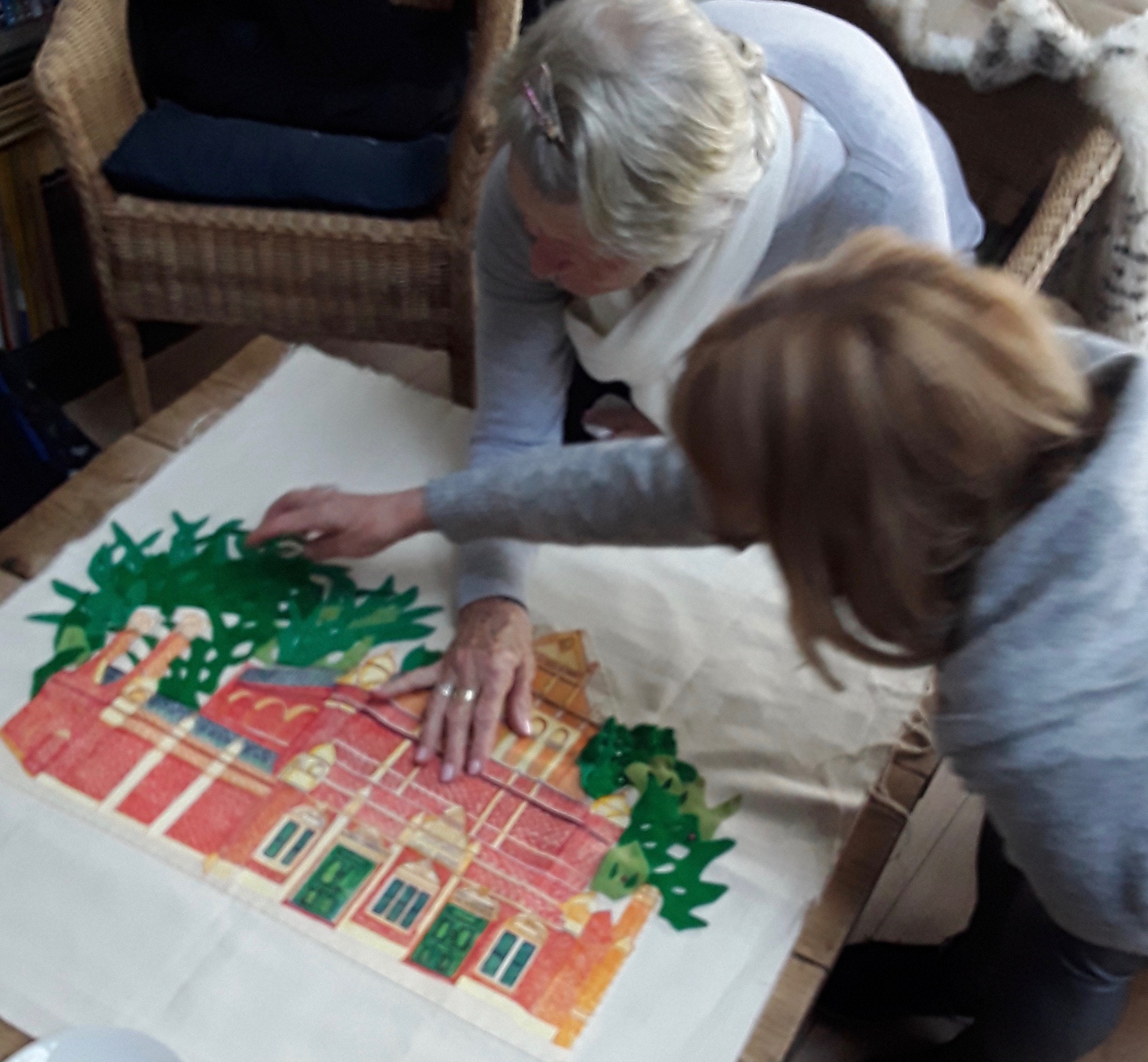 Women admiring tapestry of the baths