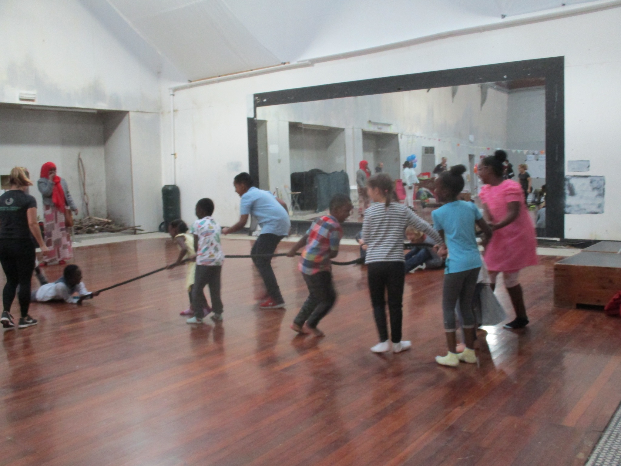 Children doing a tug of war in the dance hall