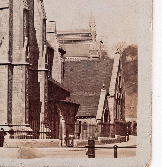 Postcard showing church in foreground, with the baths roof rising behind it